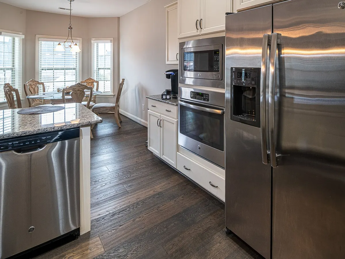 Modern kitchen with a stainless steel refrigerator and appliances